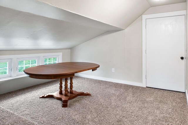 730 3rd St S, Wisconsin Rapids, WI 54494 - carpeted dining area with lofted ceiling and baseboards