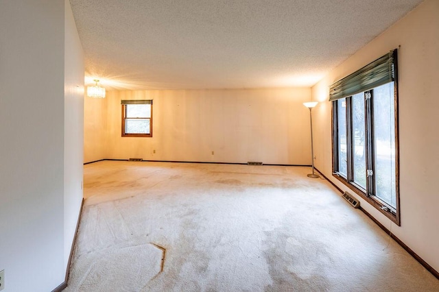 1311 Hickory St, Onalaska, WI 54650 - empty room with carpet floors and a textured ceiling