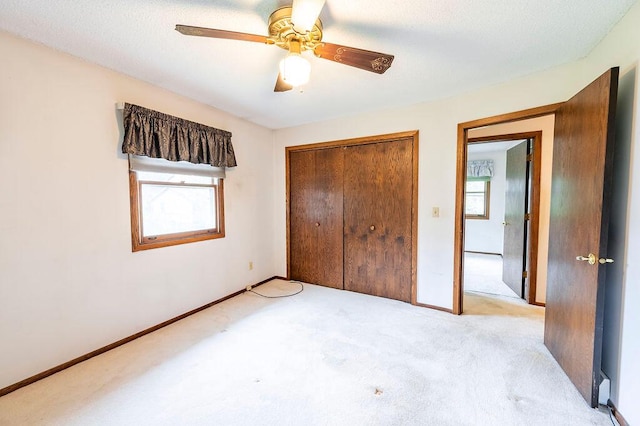 1311 Hickory St, Onalaska, WI 54650 - unfurnished bedroom featuring carpet flooring, a closet, and a ceiling fan