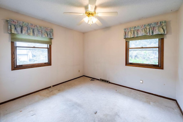 1311 Hickory St, Onalaska, WI 54650 - carpeted spare room featuring baseboards and ceiling fan