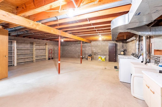 1311 Hickory St, Onalaska, WI 54650 - unfinished below grade area featuring washer and clothes dryer