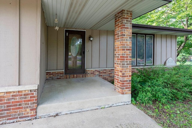 1311 Hickory St, Onalaska, WI 54650 - property entrance featuring board and batten siding