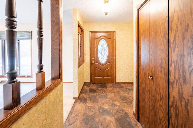 1311 Hickory St, Onalaska, WI 54650 - doorway to outside featuring stone finish floors and baseboards
