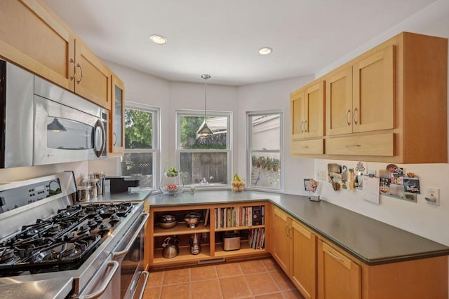 5961 N Lake Dr, Whitefish Bay, WI 53217 - kitchen featuring appliances with stainless steel finishes, dark countertops, light tile patterned flooring, pendant lighting, and recessed lighting