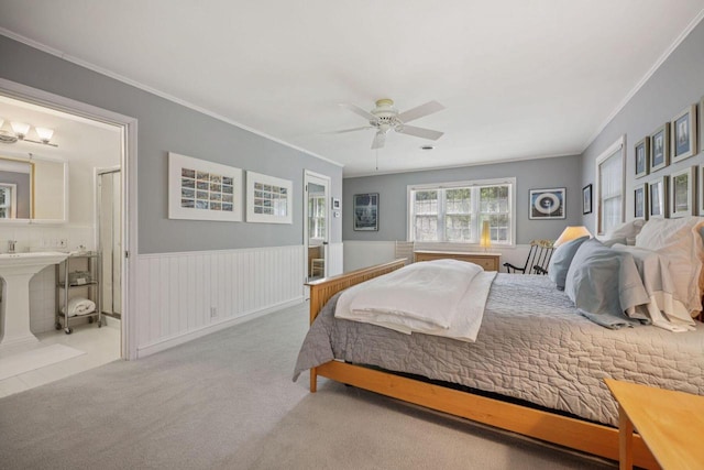 5961 N Lake Dr, Whitefish Bay, WI 53217 - bedroom featuring crown molding, carpet floors, wainscoting, connected bathroom, and a ceiling fan