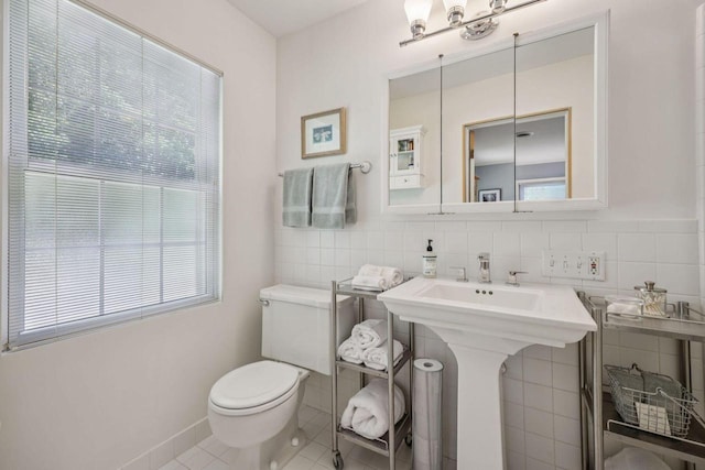 5961 N Lake Dr, Whitefish Bay, WI 53217 - bathroom with tile patterned flooring, tile walls, and a chandelier