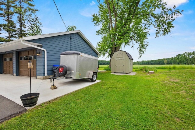 N6965 Thede Rd, Black Creek, WI 54106 - view of grassy yard with a storage unit and a garage