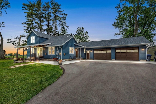 N6965 Thede Rd, Black Creek, WI 54106 - view of front facade featuring driveway, a garage, a front yard, and roof with shingles