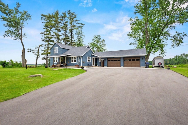 N6965 Thede Rd, Black Creek, WI 54106 - view of front of home with an attached garage, driveway, and a front lawn