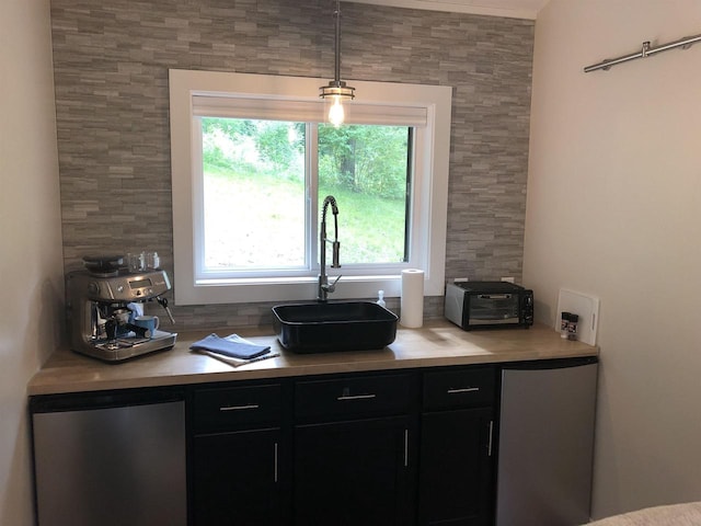 N4857 Oak Valley Ln, Elroy, WI 53929 - kitchen with fridge, light countertops, dark cabinets, and pendant lighting
