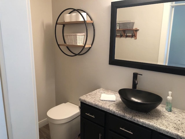 N4857 Oak Valley Ln, Elroy, WI 53929 - half bathroom featuring vanity and toilet