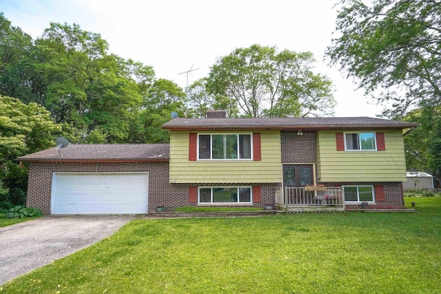 2743 Bluebird Ln, Cottage Grove, WI 53527 - bi-level home with driveway, an attached garage, a front lawn, and brick siding