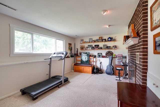 2743 Bluebird Ln, Cottage Grove, WI 53527 - exercise room with carpet and a fireplace