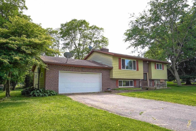 2743 Bluebird Ln, Cottage Grove, WI 53527 - bi-level home featuring brick siding, driveway, an attached garage, and a front yard