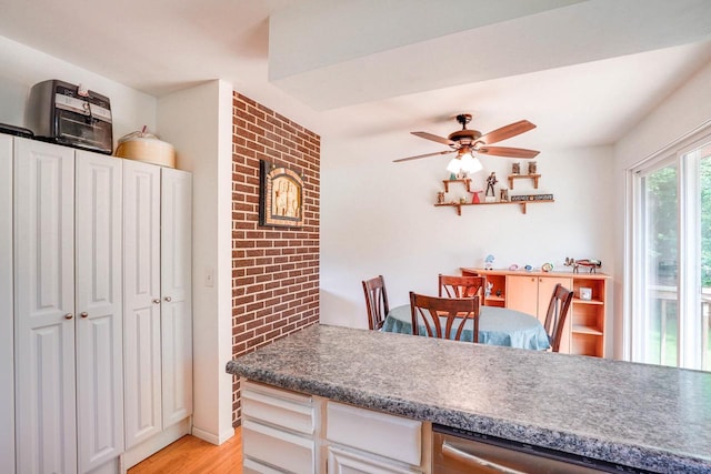 2743 Bluebird Ln, Cottage Grove, WI 53527 - kitchen with light wood finished floors, a ceiling fan, dishwasher, and white cabinetry