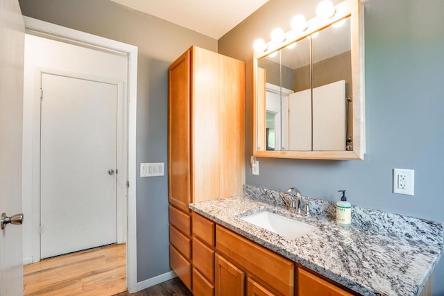 2743 Bluebird Ln, Cottage Grove, WI 53527 - bathroom featuring wood finished floors and vanity