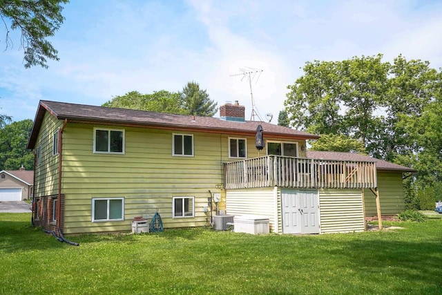 2743 Bluebird Ln, Cottage Grove, WI 53527 - rear view of house with a chimney, a yard, and a wooden deck