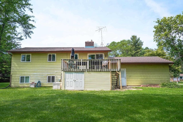 2743 Bluebird Ln, Cottage Grove, WI 53527 - rear view of house featuring a chimney, a yard, a wooden deck, and stairway