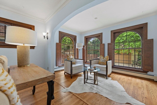 4765 N Woodburn St, Whitefish Bay, WI 53211 - sitting room with crown molding, arched walkways, a baseboard radiator, and wood finished floors