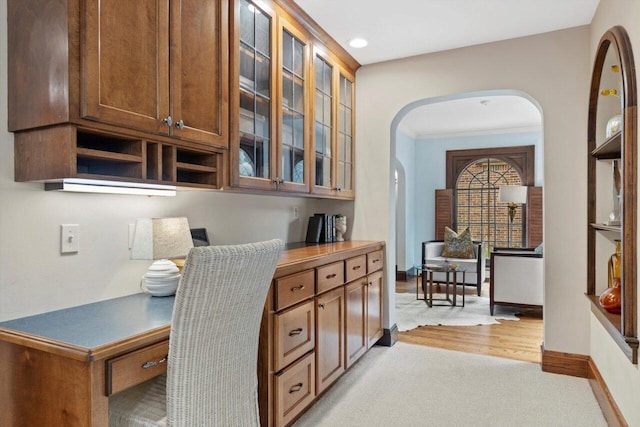 4765 N Woodburn St, Whitefish Bay, WI 53211 - office space featuring arched walkways, light colored carpet, crown molding, recessed lighting, and light wood-style flooring