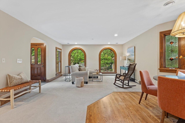 4765 N Woodburn St, Whitefish Bay, WI 53211 - living area featuring arched walkways, recessed lighting, and light carpet