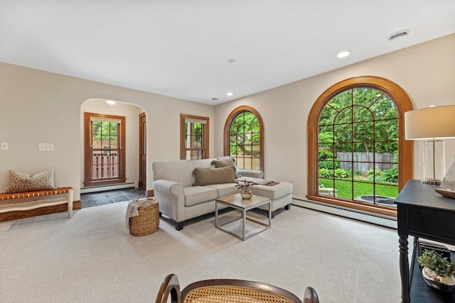 4765 N Woodburn St, Whitefish Bay, WI 53211 - carpeted living area featuring a baseboard radiator, arched walkways, plenty of natural light, and recessed lighting