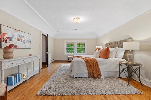 4765 N Woodburn St, Whitefish Bay, WI 53211 - bedroom featuring wood finished floors and a baseboard radiator