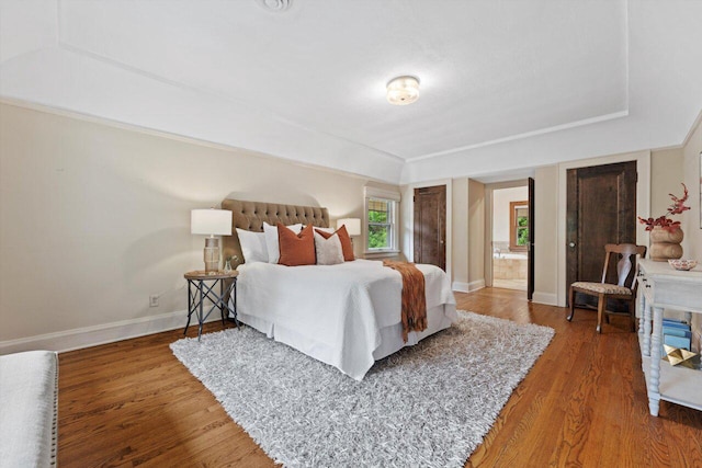 4765 N Woodburn St, Whitefish Bay, WI 53211 - bedroom with wood finished floors and a tray ceiling