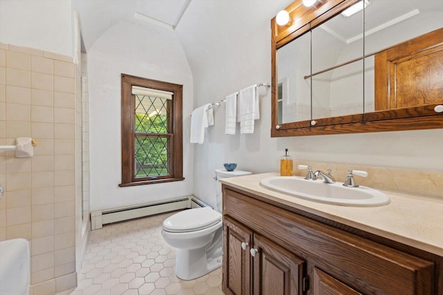 4765 N Woodburn St, Whitefish Bay, WI 53211 - bathroom featuring a baseboard heating unit, vanity, vaulted ceiling, and tile patterned flooring