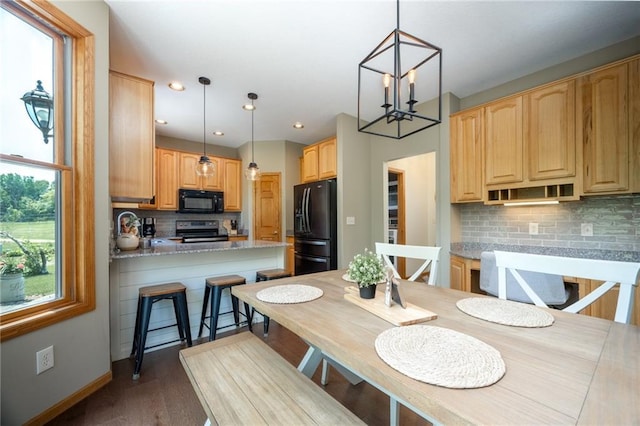 2193 County Road C, New Richmond, WI 54017 - dining room with a chandelier, wood finished floors, and recessed lighting