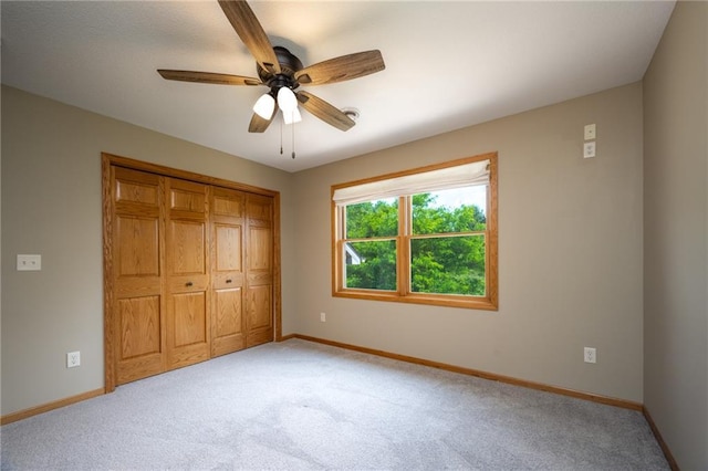 2193 County Road C, New Richmond, WI 54017 - unfurnished bedroom featuring light carpet, a closet, and ceiling fan