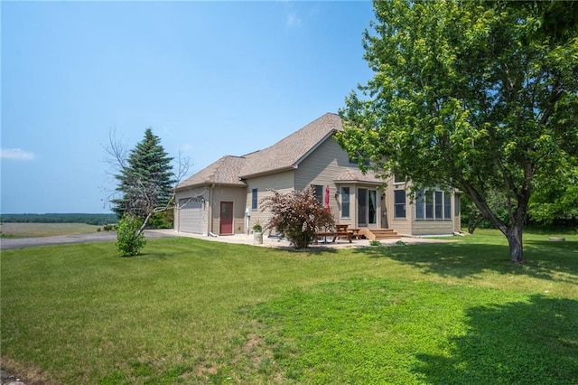 2193 County Road C, New Richmond, WI 54017 - view of front facade with a garage, entry steps, asphalt driveway, and a front lawn