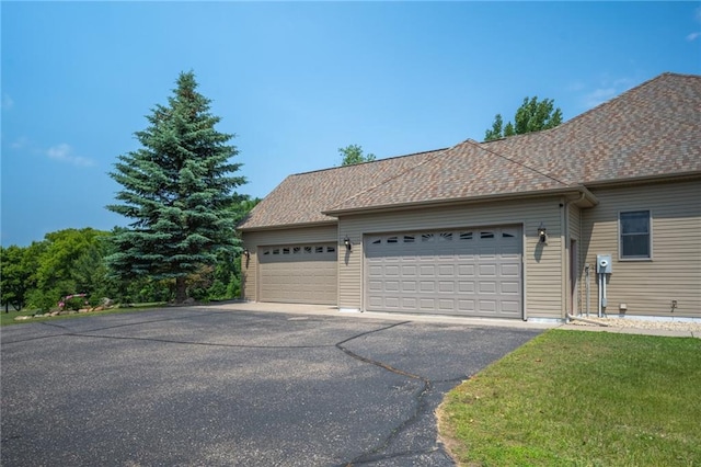 2193 County Road C, New Richmond, WI 54017 - view of side of property with an attached garage and asphalt driveway