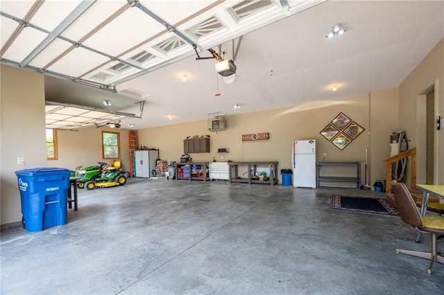 2193 County Road C, New Richmond, WI 54017 - garage with freestanding refrigerator and a garage door opener