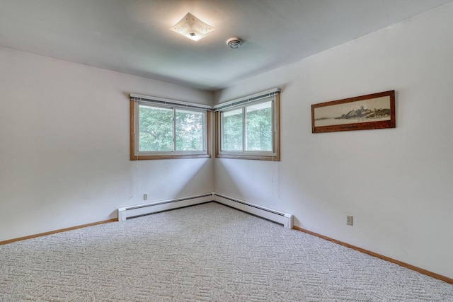 627 W Wisconsin St, Palmyra, WI 53156 - carpeted empty room with baseboards and a baseboard heating unit