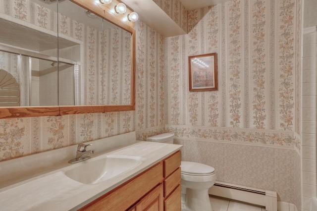 627 W Wisconsin St, Palmyra, WI 53156 - full bathroom with a baseboard radiator, vanity, a shower stall, and tile patterned floors