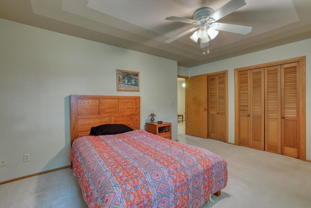 627 W Wisconsin St, Palmyra, WI 53156 - bedroom with carpet floors, two closets, and a ceiling fan