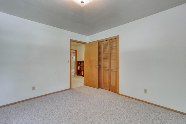 627 W Wisconsin St, Palmyra, WI 53156 - unfurnished bedroom featuring carpet flooring and a closet