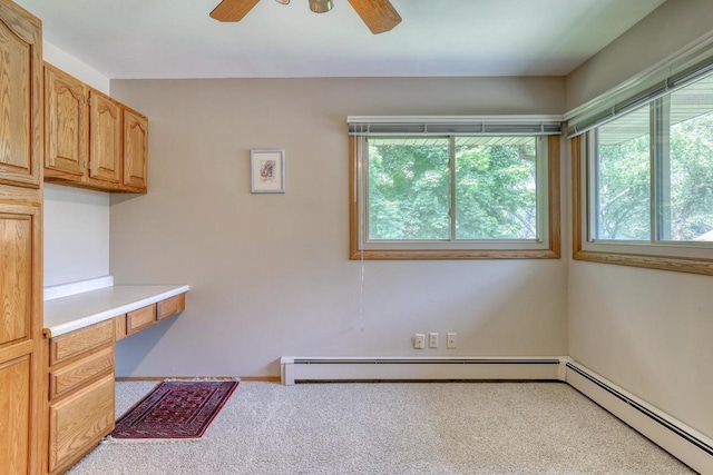 627 W Wisconsin St, Palmyra, WI 53156 - interior space featuring a baseboard radiator, a ceiling fan, and carpet flooring