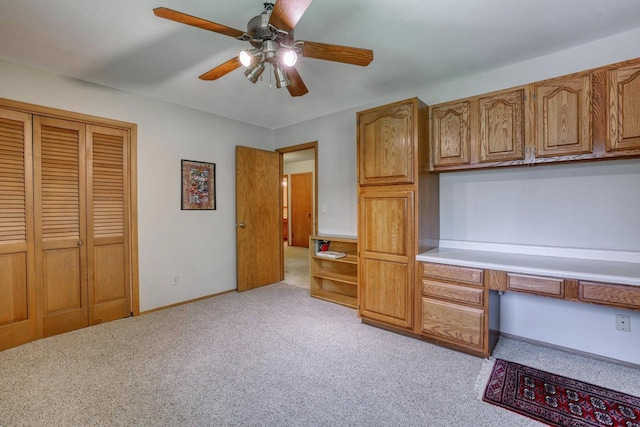 627 W Wisconsin St, Palmyra, WI 53156 - unfurnished office with built in desk, light colored carpet, and a ceiling fan