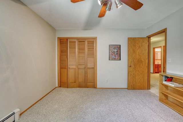 627 W Wisconsin St, Palmyra, WI 53156 - unfurnished bedroom with a baseboard radiator, a closet, carpet flooring, and ceiling fan