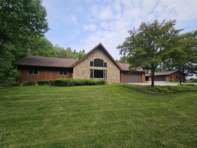 200890 Robin Rd, Marshfield, WI 54449 - view of front of home featuring a garage, a front lawn, and stone siding