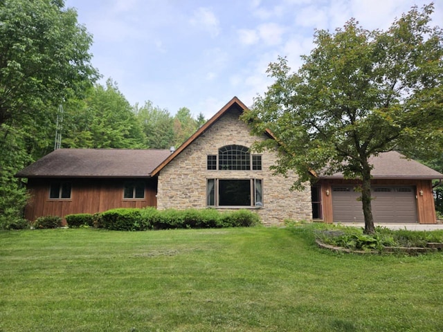 200890 Robin Rd, Marshfield, WI 54449 - view of front facade with stone siding, a front lawn, and an attached garage