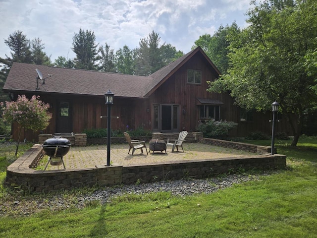 200890 Robin Rd, Marshfield, WI 54449 - back of property with an outdoor fire pit, a patio, a yard, and a shingled roof