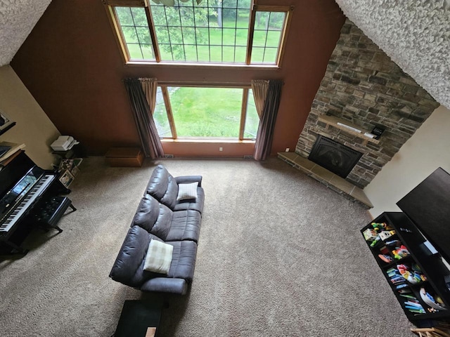 200890 Robin Rd, Marshfield, WI 54449 - carpeted living area featuring a stone fireplace and a high ceiling