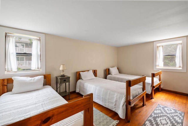 N1808 Woodland Rd, Lake Geneva, WI 53147 - bedroom with hardwood / wood-style flooring and baseboards