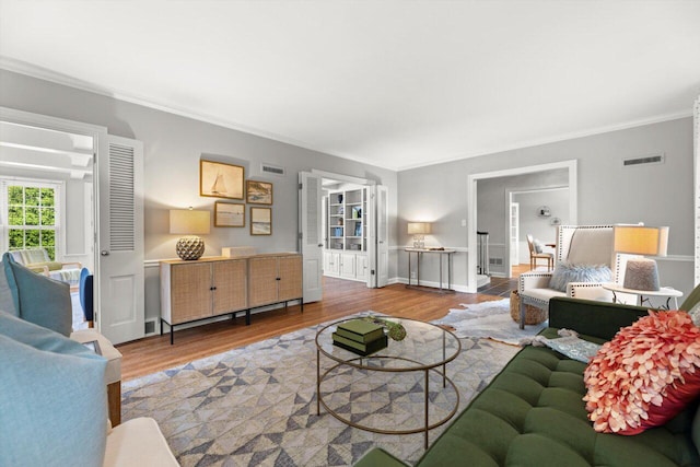 6123 N Berkeley Blvd, Whitefish Bay, WI 53217 - living area with wood finished floors and crown molding