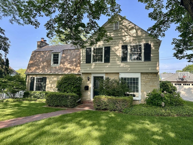 6123 N Berkeley Blvd, Whitefish Bay, WI 53217 - view of front facade featuring a front yard and a chimney