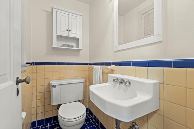6123 N Berkeley Blvd, Whitefish Bay, WI 53217 - half bath featuring tile walls, wainscoting, and tile patterned floors