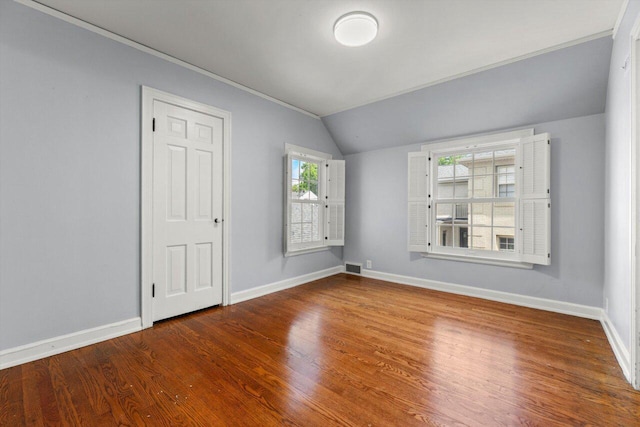 6123 N Berkeley Blvd, Whitefish Bay, WI 53217 - empty room with vaulted ceiling, wood finished floors, healthy amount of natural light, and crown molding